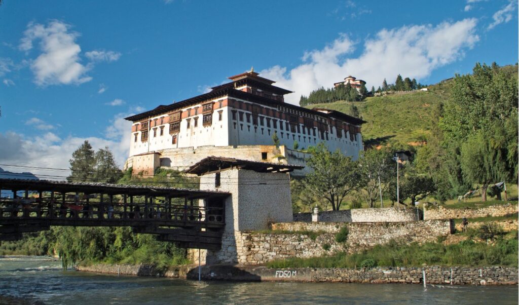 A scenic shot of the confluence of Paro and Thimphu rivers at Chuzom, showcasing the lush greenery and serene waters.