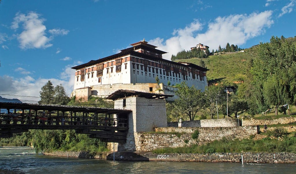 A scenic shot of the confluence of Paro and Thimphu rivers at Chuzom, showcasing the lush greenery and serene waters.