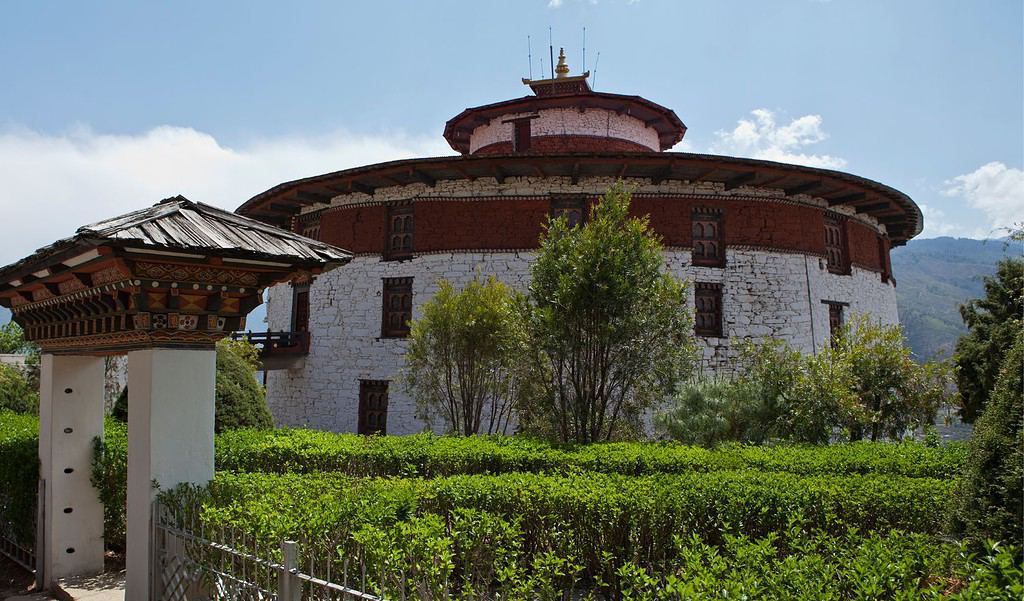 A captivating shot of Ta Dzong, formerly a watchtower and now the National Museum of Bhutan, showcasing its unique circular structure.