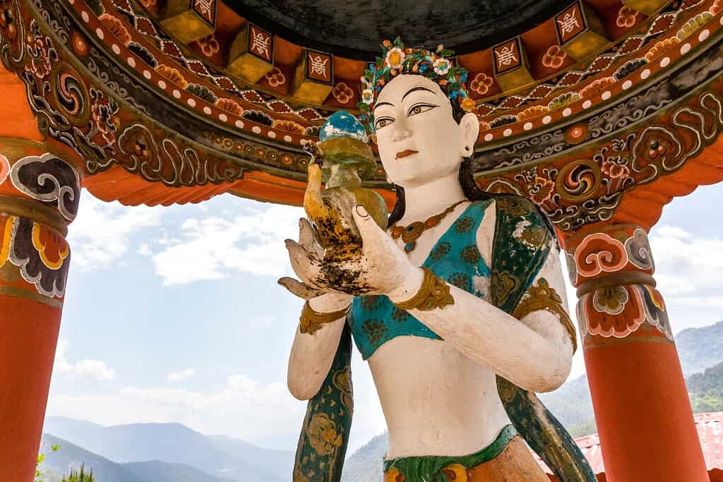 A stunning photograph of Khamsum Yuelley Namgel Chorten, an intricately adorned Buddhist stupa nestled in the picturesque Punakha Valley.