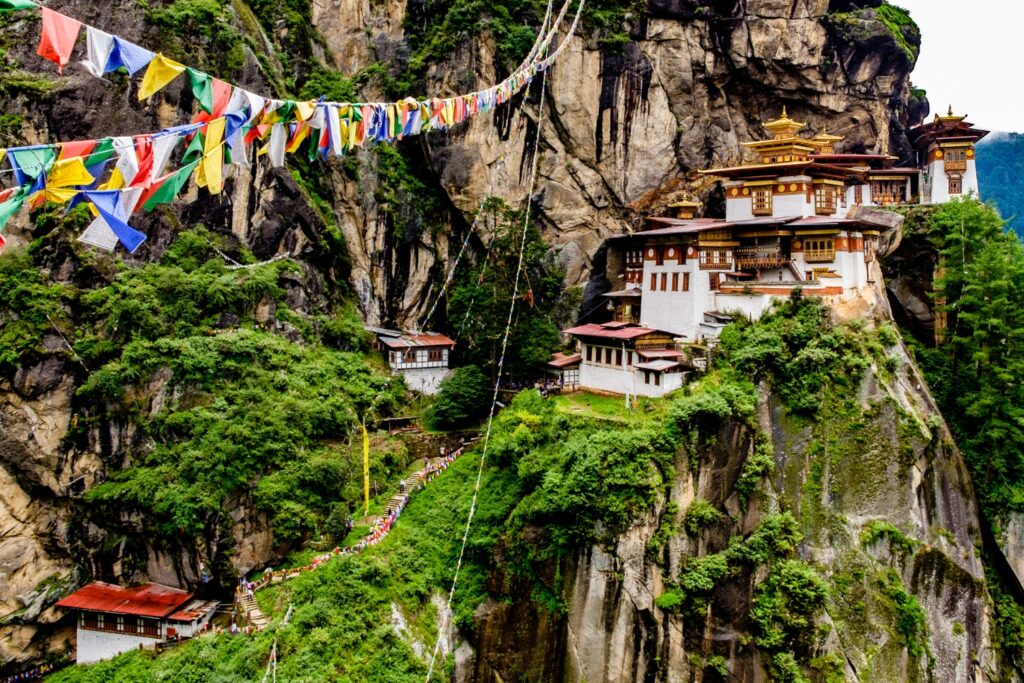 Serene image of Tango Goemba Monastery nestled amidst verdant hills, exuding an aura of spirituality.